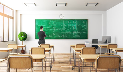 Businessman with math formulas