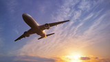 Airplane on bright sky backdrop