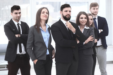 close up.leader and business team standing together and looking at copy space