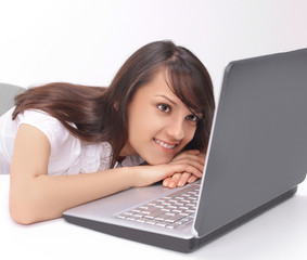 portrait of a young employee behind her Desk.