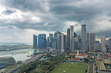Naklejka na ściany i meble Singapore skyline against cloudy sky