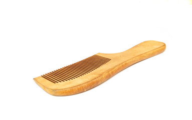 Wooden comb isolated on white background.