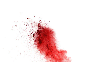 Abstract of red powder explosion on white background. Colored powder splatted isolate. Colored...