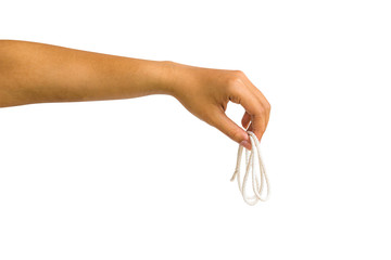 A cropped of female hand holding white rope against white background include clipping path.
