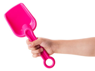 Baby pink plastic spatula in a child's hand