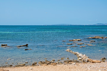 Fototapeta na wymiar Natural coastal summer landscape with rocks formation and crystal blue ocean.