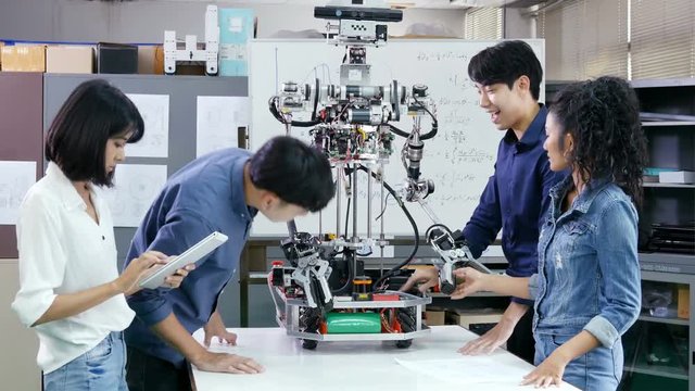 Male engineer present project with team. Team engineer start up for robot project together. People with technology or innovation concept. 4K Resolution.