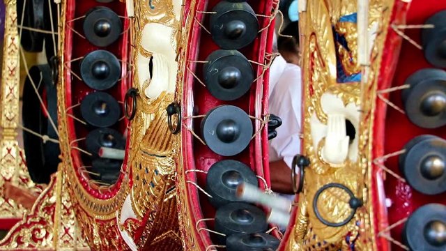 Playing a traditional musical instrument Khong Wong, Thailand. Musician playing on Kong wong - Thai musical instrument.