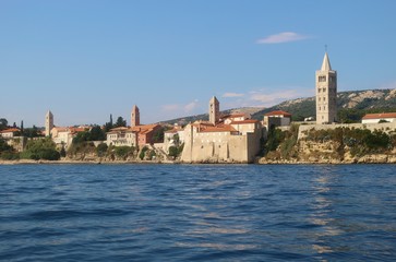Panoramic view of the old town of Rab with the famous four clock towers. On Rab island, Croatia, South-East Europe.