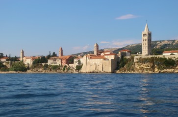 Fototapeta na wymiar Panoramic view of the old town of Rab with the famous four clock towers. On Rab island, Croatia, South-East Europe.