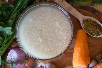 Rice for cooking pilaf meat with rice on fire in the cauldron. Recipe