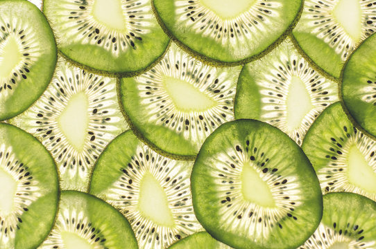 Uniform background of stacked thin slices of kiwi