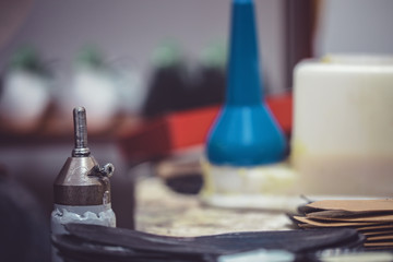 Shoemaker workshop for making shows artisan handmade manufacturing leather shoes. Shoe manufacture business for traditional vintage shoe making, craft boots in traditional style