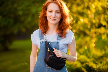 Red-haired girl with waist bag