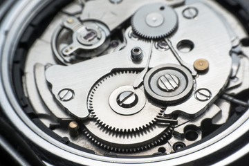 Mechanical watch / Gear Clock. Close up cogs and gears inside clock background