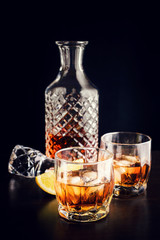 Drink in a glass decanter and two glasses