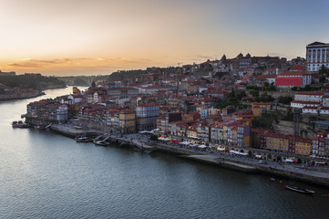 Obraz premium Aerial view of the Ribeira Neighborhood and the Douro River with Rabelo Boats, in the city of Porto, Portugal