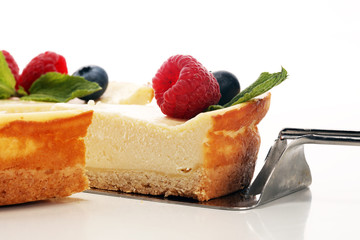 Homemade cheesecake with fresh raspberries and mint for dessert - healthy organic summer dessert pie cheesecake. Vanilla Cheese Cake