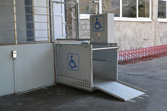 The elevator for disabled people vertical street at an entrance to the building