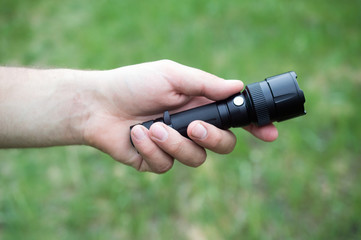 hand lantern in the male palm close-up, led light