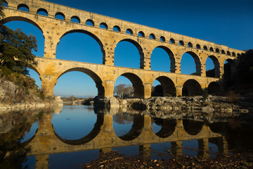 Famous landmark Roman Bridge Pont du Gard in southern France - obrazy, fototapety, plakaty