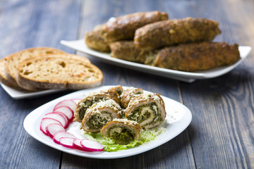 pork roulades stuffed with spinach sprinkled with freshly grated horseradish