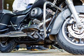 Vintage motorcycle parking on the road. Side view, close up