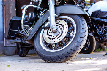 Vintage motorcycle parking on the road. Side view, close up