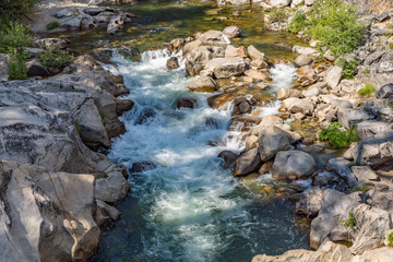 Looking Down at the Stainslaus River Flowing Over Boulders