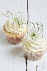 White cupcakes with flowers