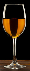 Glass still life image A glass of red wine in a glass on a black background