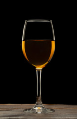 Glass still life image A glass of red wine in a glass on a black background