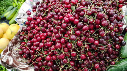 Red and juicy fresh cherries. Rich in Nutrients. Good source of vitamin, antioxidants and anti-inflammatory compounds. Helps lower the risk of heart disease. Healthy eating and eat well concept
