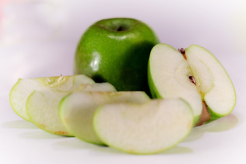 green Apple in a cut on a perfect white background