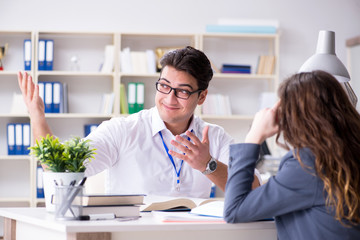 Sales assistant discussing transaction with customer