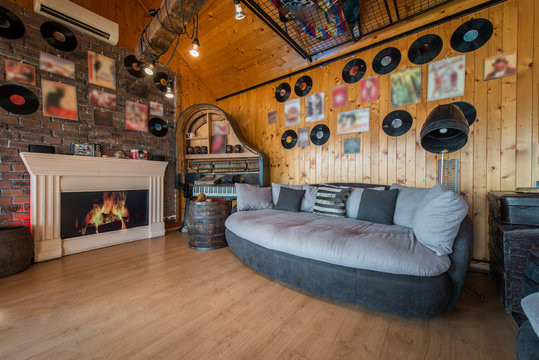 Decorated walls in music theme in living room interior