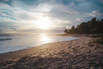 Cloudy peaceful sunset on the long beach of Playa Carmen in Santa Teresa, Costa Rica