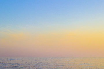 The sea at sunset, the sky in pastel colors.