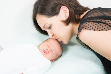 Little newborn boy baby embrace of mother