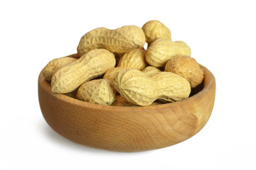 Bowl of dry roasted peanuts isolated on white background
