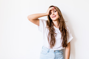 Fototapeta premium Young woman suffering of the pain over white background
