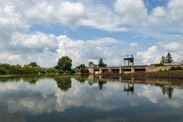 Fototapeta na wymiar River with blue sky and clouds in summer day