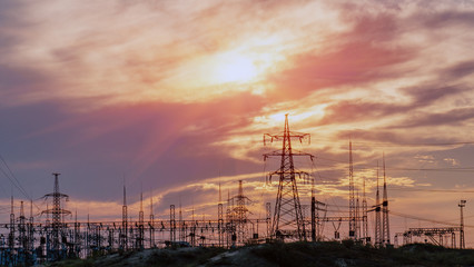 High power electricity poles in urban area. Energy supply, distribution of energy, transmitting...