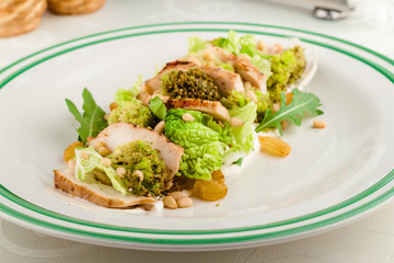 Salad with ruccola, grilled turkey or chicken, dried cranberries, pine nuts and citrus sauce.