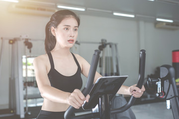 Fototapeta premium Fitness woman health exercise at gym. Healthy workout concepts.