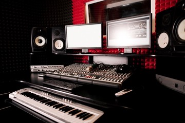 Recording Studio with a synthesizer and a remote control
