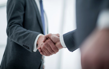 close up. handshake of business people on a light background.