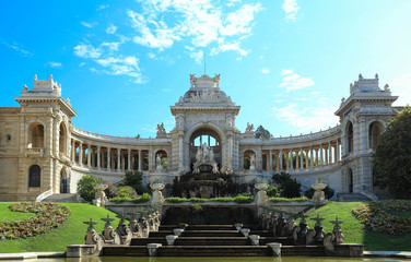 Longchamp palace in Marseille under blue sky.