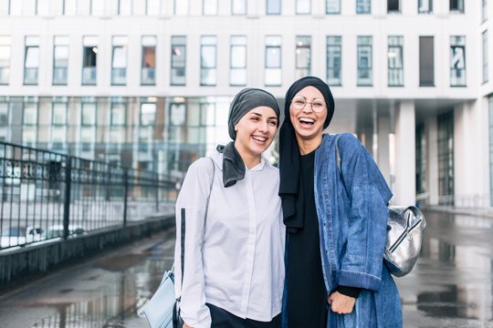 Muslim women in hijab walking around the city