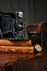 Retro camera, clock and antique books